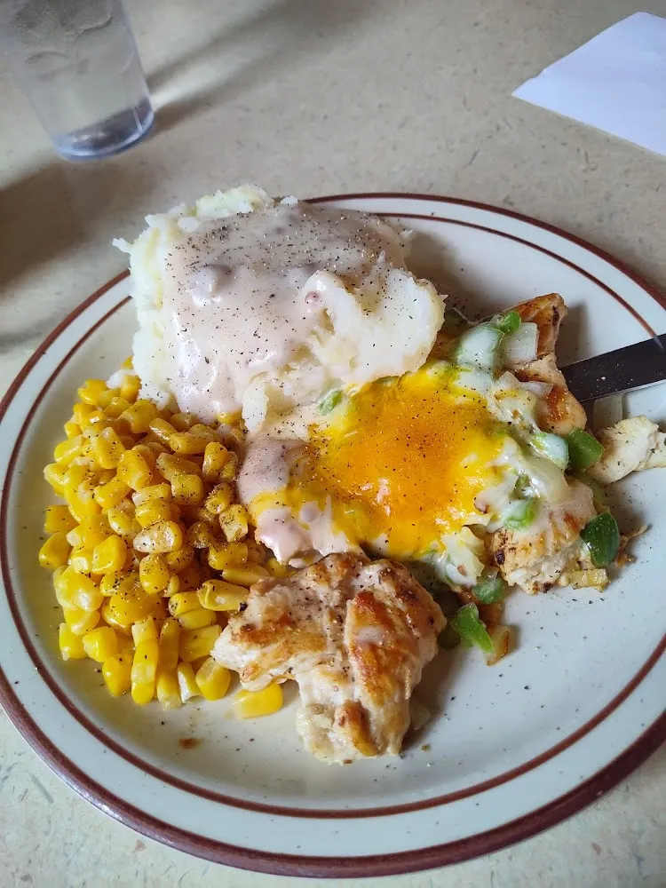Smothered Chicken with Corn and Mashed Potatoes and Gravy